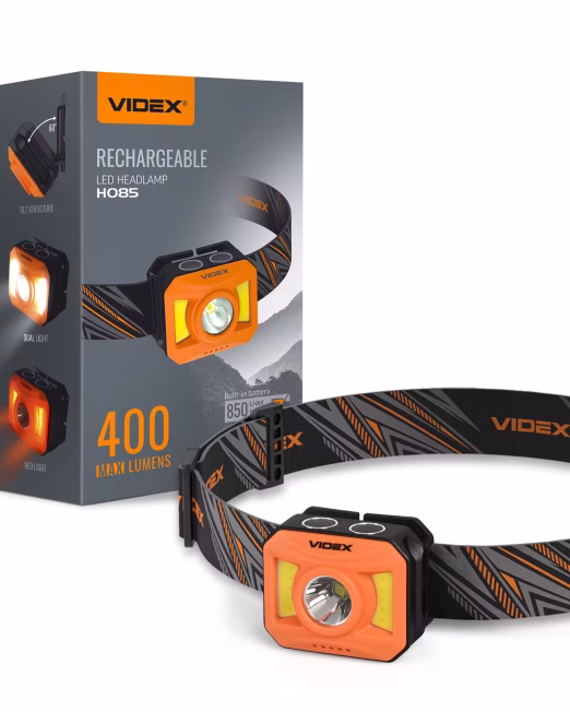 Latarka czołowa Videx VLF‑H085‑OR – 400 lm, zasięg 110 m, 8 trybów, sensor USB‑C, wodoodporność IP65. Lekka, wytrzymała, z akumulatorem Li‑pol 850 mAh.